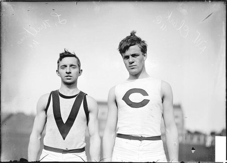 Athletes, A. W. Clark and L. G. Wilkins, University of Chicago, standing on the field at Marshall Field - Chicago Daily News, Inc.