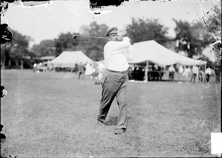 Golfer, C. P. Cory, demonstrating a swing on the grounds of the Chicago Golf Club - Chicago Daily News, Inc.