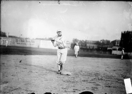 Baseball player, Jiggs Donahue, Chicago White Sox, standing at second base throwing a ball, South Side Park - Chicago Daily News, Inc.