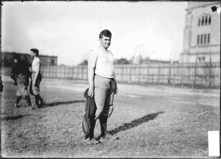 University of Chicago football player F. R. Handy, standing on the field at Marshall Field - Chicago Daily News, Inc.