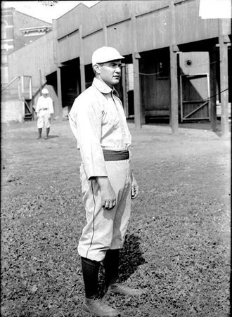 Baseball player Delhanty, standing on a baseball field - Chicago Daily News, Inc.