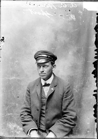 Sportsman A. A. Hansen, sitting in front of a plain backdrop in a room - Chicago Daily News, Inc.
