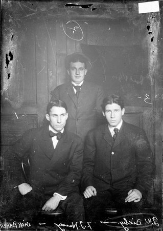 Dick Baker, F. G. Hussey, J. W. Bixby, gathered in a room in the Chicago Daily News building - Chicago Daily News, Inc.