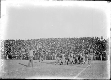 University of Chicago and Nebraska football game, players running near sideline on Marshall Field - Chicago Daily News, Inc.