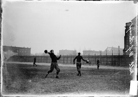 University of Chicago football player, Noll, throwing a football during practice on Marshall Field - Chicago Daily News, Inc.