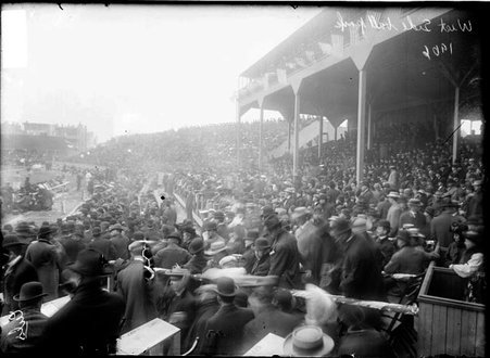 Spectators standing around the bleachers and in the stands during a National League's Chicago Cubs game at West Side Grounds - Chicago Daily News, Inc.