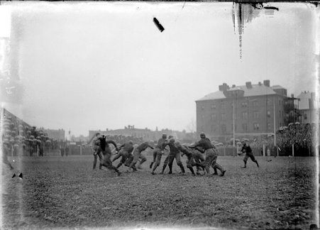 Football player who has broken through the defense during a game between University of Chicago and University of Minnesota - Chicago Daily News, Inc.