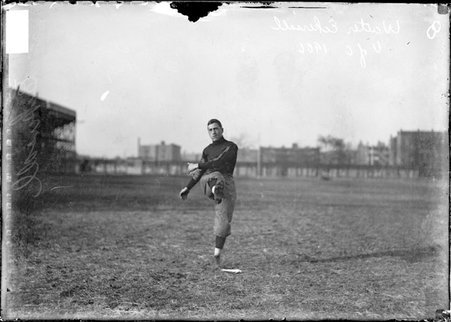 University of Chicago football player Walter Eckersall, kicking his right leg up, standing facing the camera at Marshall Field - Chicago Daily News, Inc.
