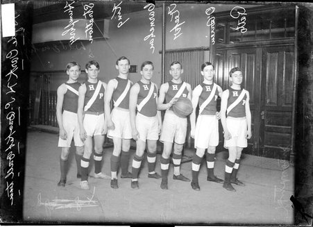 Basketball players, Hyde Park High School, O'Brien, King, Keeper, Stratton, Carnahan, Humphrey, Ratto, standing in a gymnasium - Chicago Daily News, Inc.