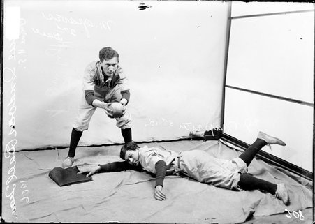 Indoor baseball players, Crane Tech., Naprster and Graves, posing in front of a backdrop - Chicago Daily News, Inc.
