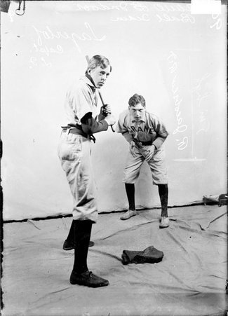 Indoor baseball players, Crane Tech., Lagerlof standing in a batting stance, Jacobson standing in background - Chicago Daily News, Inc.