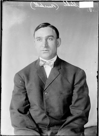Boston Red Sox baseball player Jake Stahl, sitting in front of a light-colored backdrop in a room - Chicago Daily News, Inc.