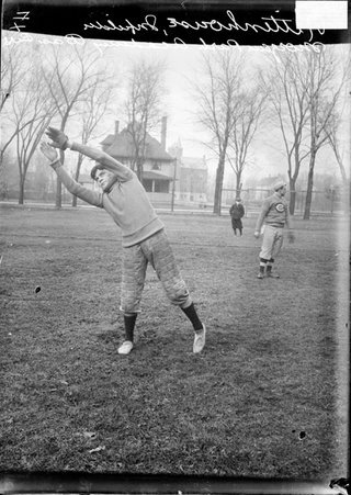 Morgan Park Academy baseball infielder Rittenhouse, leaning to his right and extending his arms above his head, standing on a field - Chicago Daily News, Inc.