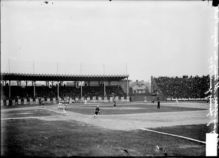 White Sox baseball players, standing in defensive position and St. Louis Browns baserunners, running the bases on the field - Chicago Daily News, Inc.