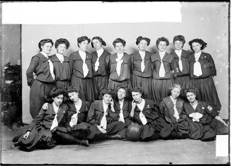 LaSalle Turnverein members posing in front of a light-colored backdrop in a room - Chicago Daily News, Inc.
