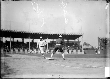 St. Louis Browns baseball player T. Jones, running to first base from home plate, White Sox first baseman Jiggs Donohue is on base - Chicago Daily News, Inc.
