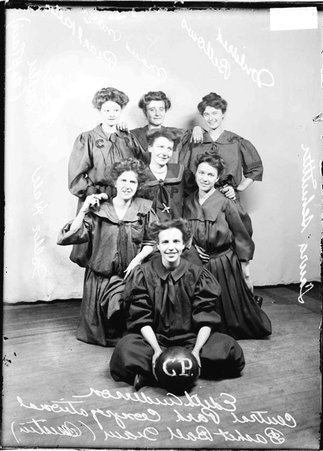 Central Park Congregational girls' basketball players, posing in front of a backdrop - Chicago Daily News, Inc.