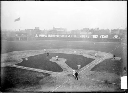 Unidentified batter running from home plate to first base during a baseball game at West Side Grounds - Chicago Daily News, Inc.