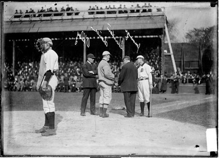 Umpires Sheridan and Hank O'Day standing with baseball players Hugh Jennings, and Frank Chance, behind home plate - Chicago Daily News, Inc.