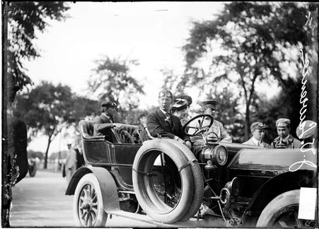Autoist, J. V. Lawrence, sitting in an automobile - Chicago Daily News, Inc.
