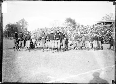 University of Chicago football players walking off the athletic field at a game in Urbana, Illinois - Chicago Daily News, Inc.