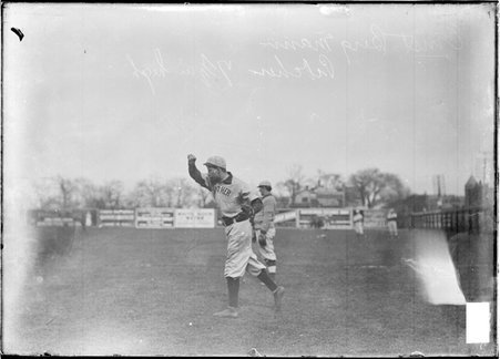 Gunthers baseball pitcher Ernest Bergmann, following through after throwing a baseball, standing on a baseball field - Chicago Daily News, Inc.