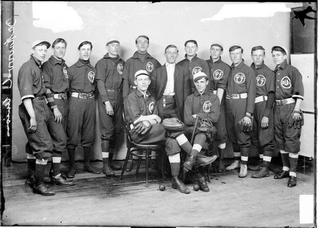 Baseball team, Oakwood Union, posing against backdrop - Chicago Daily News, Inc.