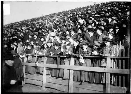 Women spectators standing in the bleachers at a University of Chicago football game at Marshall Field in the Hyde Park community area - Chicago Daily News, Inc.