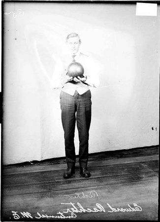 Centennial M. E. Church bowler, Edward Richter, holding a bowling ball at chest height - Chicago Daily News, Inc.