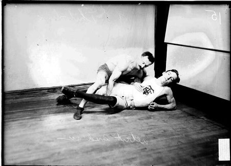 Wrestlers, Thibodeaux holding Bredlau through the legs and right arm. - Chicago Daily News, Inc.