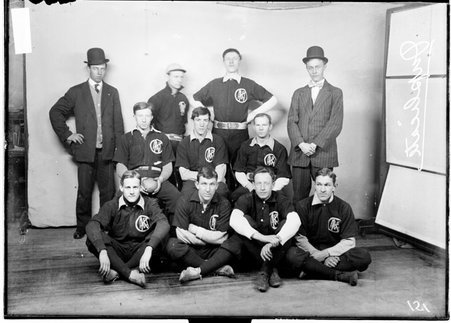 Indoor baseball team, Marquette, J posing in front of a light colored background, duplicate - Chicago Daily News, Inc.