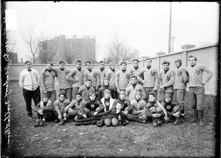 Football team, St. Vincent's College posing on an athletic field - Chicago Daily News, Inc.