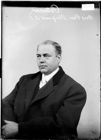 Vice president of the Sleipner Athletic Club, Peterson, sitting in front of a plain background in a room - Chicago Daily News, Inc.