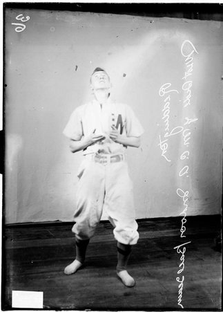 Indoor baseball player, West Side YMCA, Reddington, YMCA posing as if catching a fly ball - Chicago Daily News, Inc.