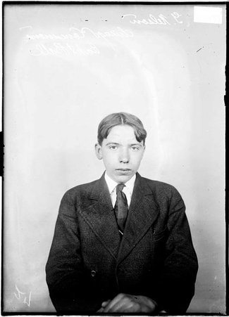 Chicago Commons basketball player, G. Nelson, sitting in front of a light colored background in a room - Chicago Daily News, Inc.