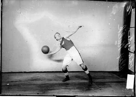 Basketball player, White Eagles, A. Kulik, preparing to throw a basketball with his right hand - Chicago Daily News, Inc.
