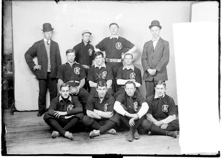 Indoor baseball team, Marquette, J posing in front of a light colored background - Chicago Daily News, Inc.
