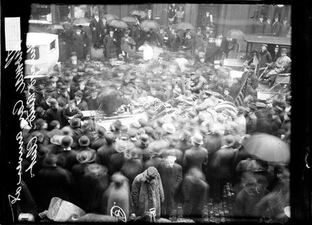 Crowds standing in the street and on the sidewalk around the Thomas car, of the New York-Paris Auto Race, arriving at Chicago Auto Club - Chicago Daily News, Inc.