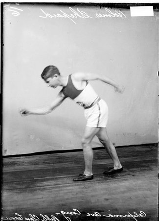 California Avenue Congregational Church, Bible Class League, basketball player Holmes Shepard, leaning forward swinging his arms - Chicago Daily News, Inc.