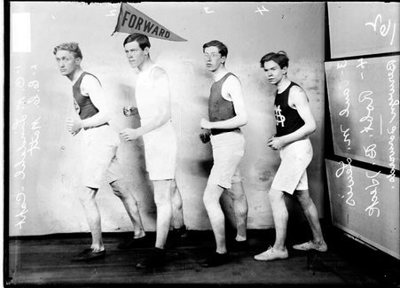 Berwyn Forwards basketball team players K. C. Matt, Robert B. Heck, O. M. Lindahl and Paul M. Lewis posing in front of a backdrop - Chicago Daily News, Inc.