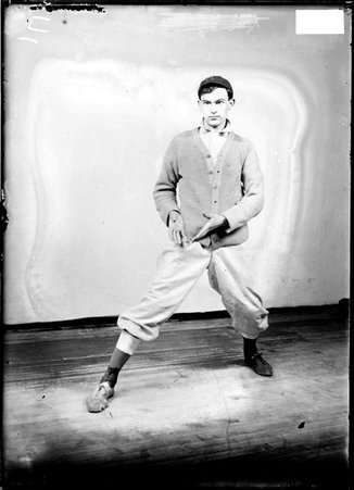George Young & Co. indoor baseball player A. Seiffert, holding his hands in front of his right side standing in front of a backdrop - Chicago Daily News, Inc.