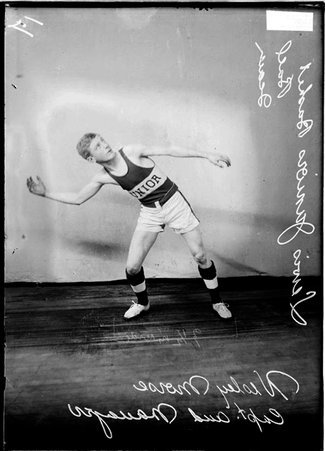 Lewis Junior basketball player Wesley Morse, posing in front of a backdrop, leaning to right with his arm out to side, text on image - Chicago Daily News, Inc.