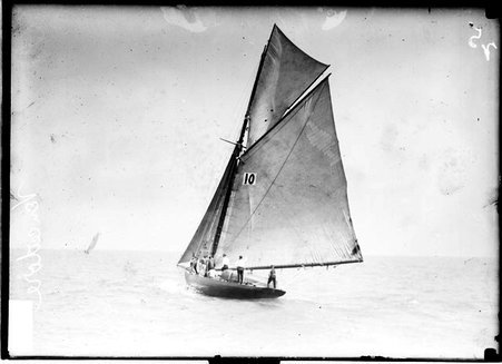 Yacht, the Vencedor, sailing on the water of Lake Michigan, crew members are visible standing on the deck of the yacht - Chicago Daily News, Inc.