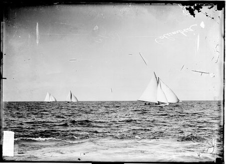 Yacht, the Columbia, sailing on Lake Michigan during the Lipton Cup Yacht Race, two unidentified yachts are visible in the background - Chicago Daily News, Inc.