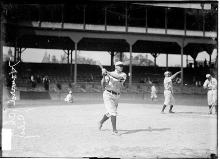 Chicago Cubs baseball player Del Howard, swinging a bat on the field at West Side Grounds - Chicago Daily News, Inc.