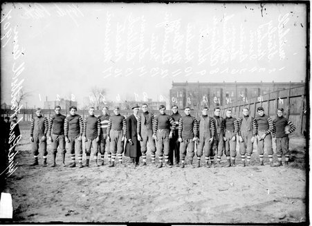 Hyde Park High School football team standing on an athletic field - Chicago Daily News, Inc.