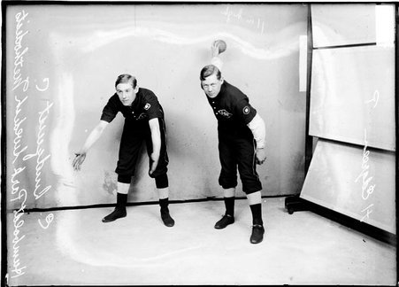 Humboldt Park Swedish Methodist indoor baseball players, catcher E. Lindquist and H. Edgren, standing in front of a backdrop - Chicago Daily News, Inc.
