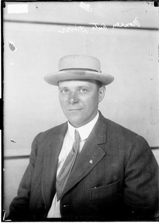 Motorist A. Monsen wearing a hat, sitting in front of a light-colored backdrop - Chicago Daily News, Inc.