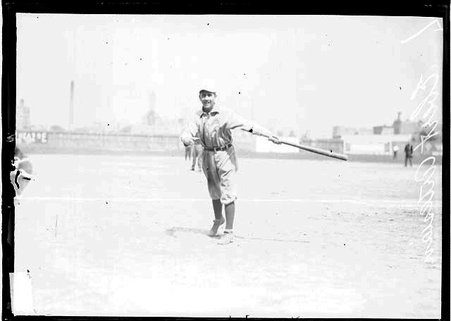 Artesans baseball player, Ebert, following through after swinging a baseball bat, standing on a baseball field - Chicago Daily News, Inc.