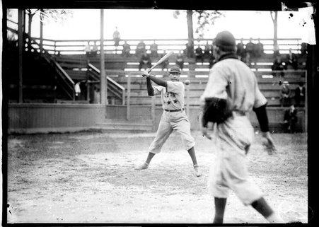 Cubans baseball player, Sagua, holding a bat, ready to swing at a baseball in the air in front of him, standing at home plate - Chicago Daily News, Inc.